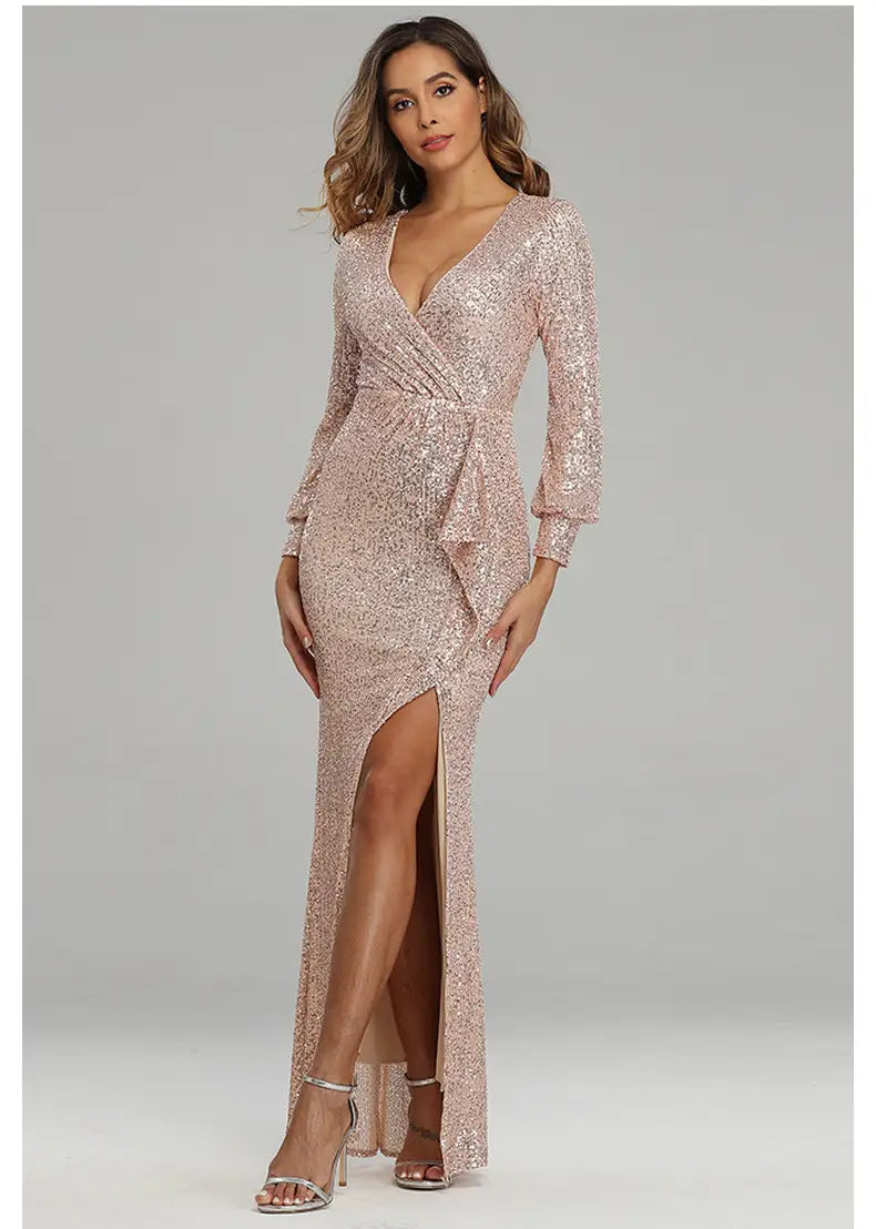 A shimmering rose gold sequined evening dress with a deep v-neckline, long sleeves, and a sexy high slit in the fantasy celebrity sexy collection.