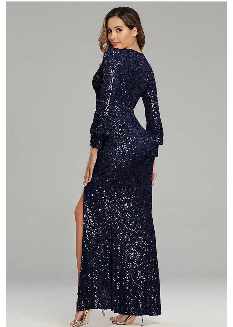 A navy blue sequined floor-length evening dress with long sleeves and a sexy high slit from the fantasy celebrity sexy collection.
