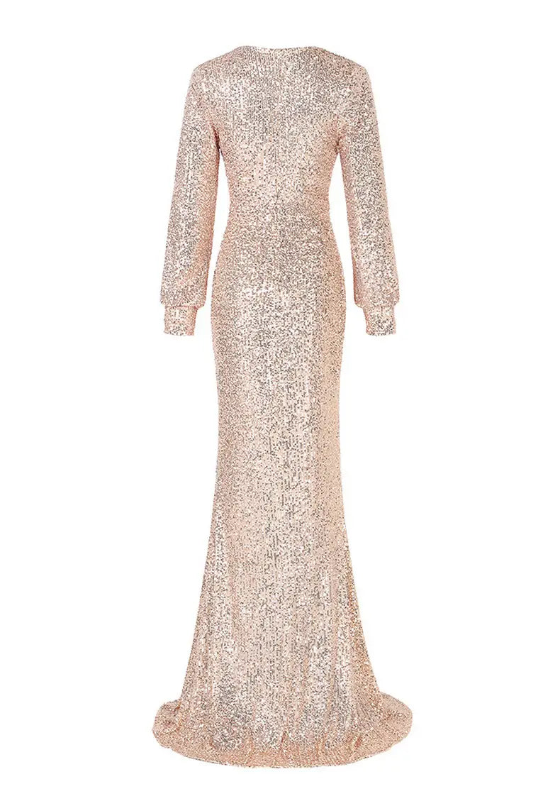 A shimmering rose gold sequined floor-length evening dress with long sleeves and a fitted silhouette featuring a sexy high slit, perfect for a fantasy celebrity sexy look.