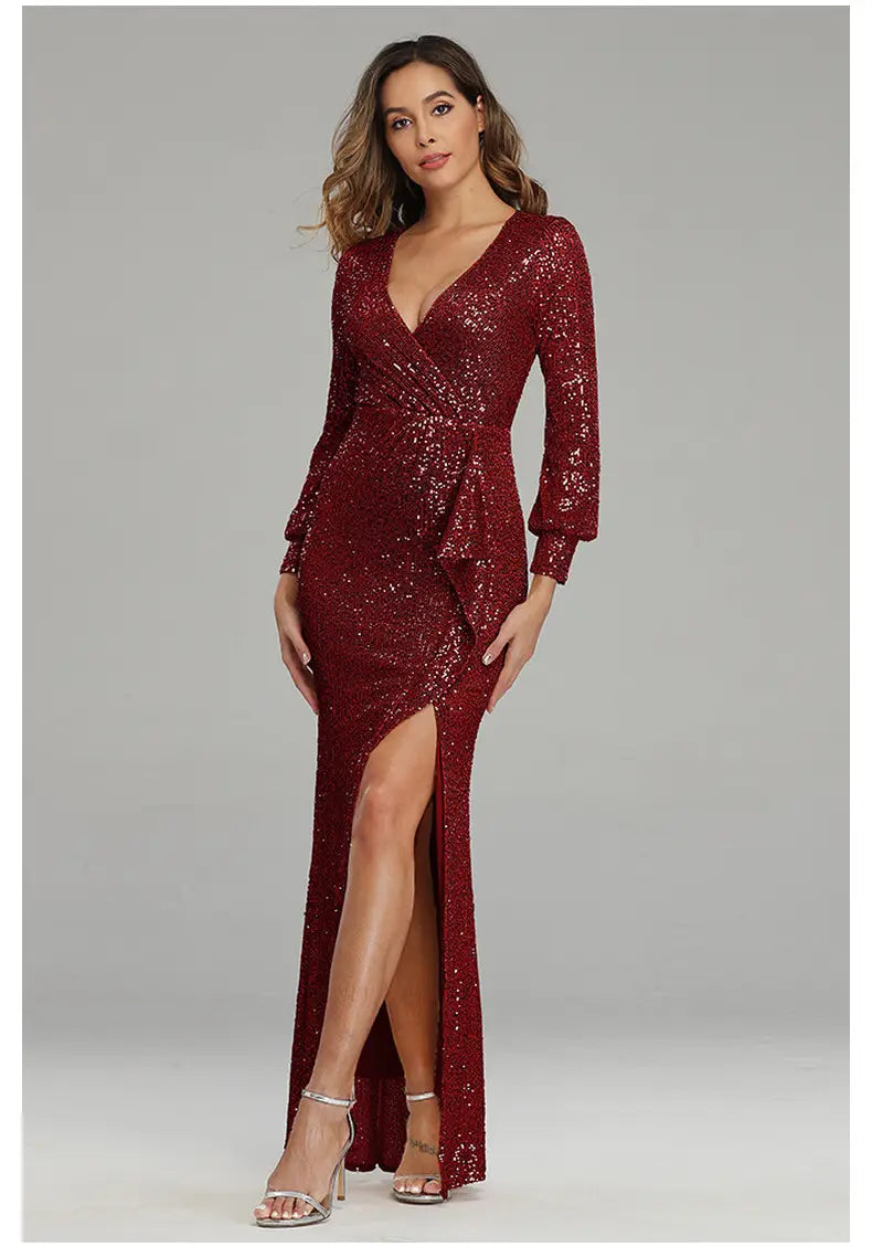 A shimmering burgundy sequined fantasy celebrity sexy evening dress with a deep v-neckline long sleeves and a sexy high slit.
