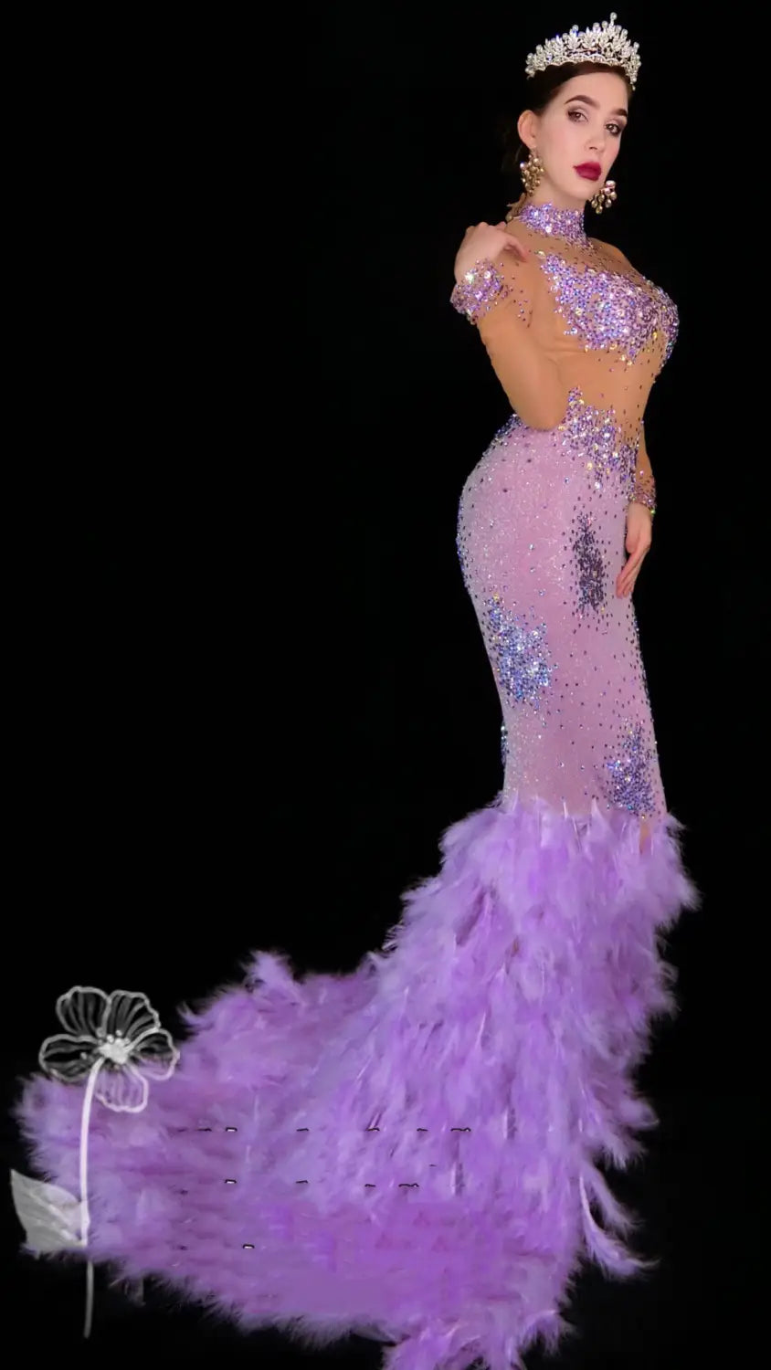 A shimmering lavender mermaid gown featuring sparkling sequins and a voluminous diamond feather mesh wrap hip train.