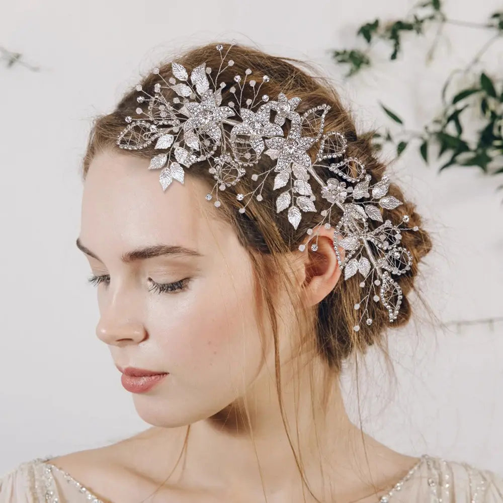 Handmade environmentally friendly silver floral headpiece crafted from environmentally friendly alloy with sparkling crystals and delicate leaf designs.
