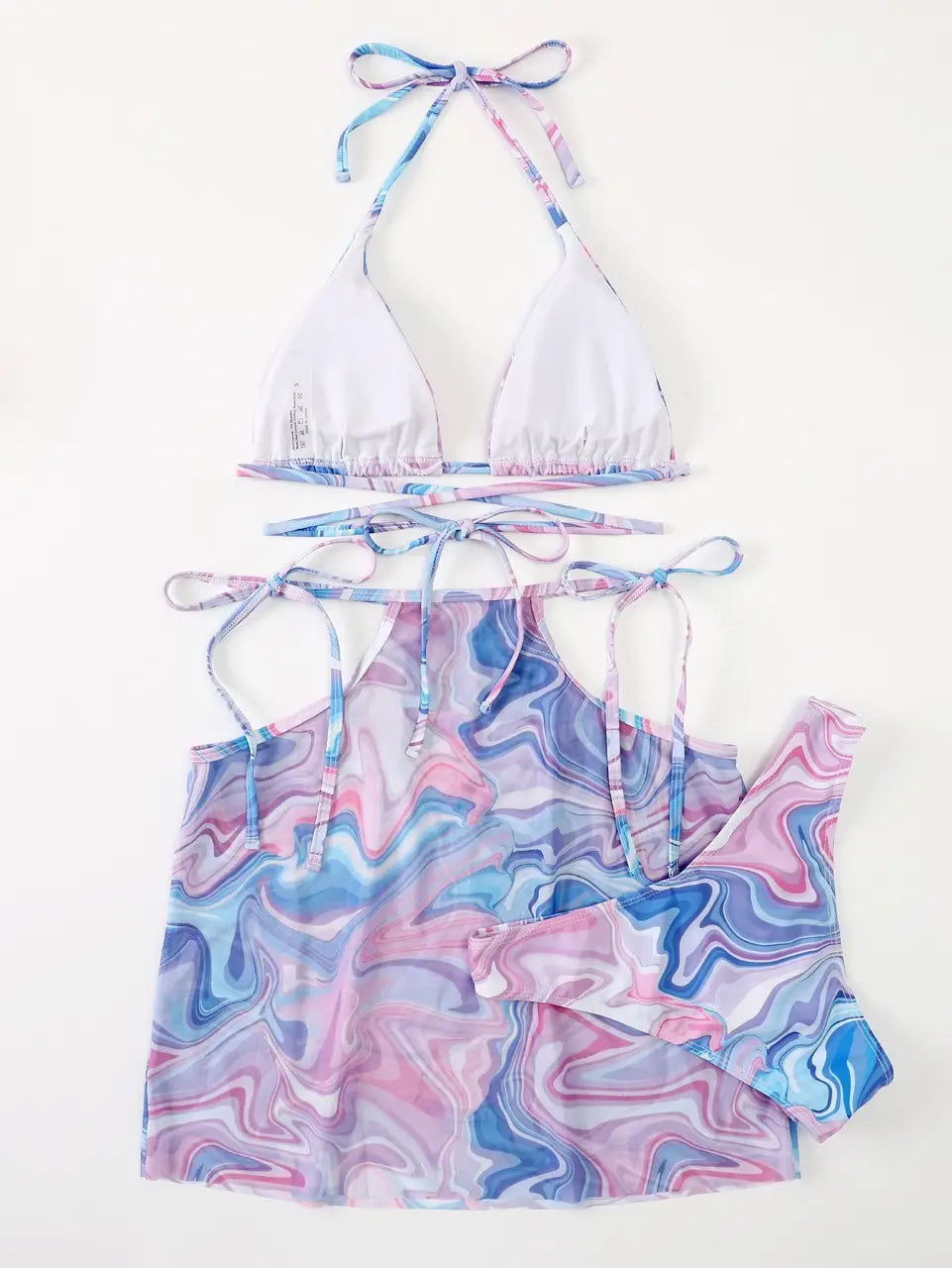 a pastel marble-patterned bikini 3-piece beach set featuring a white halter top and matching pink and blue tie-side beach skirt designed for stylish beachwear.