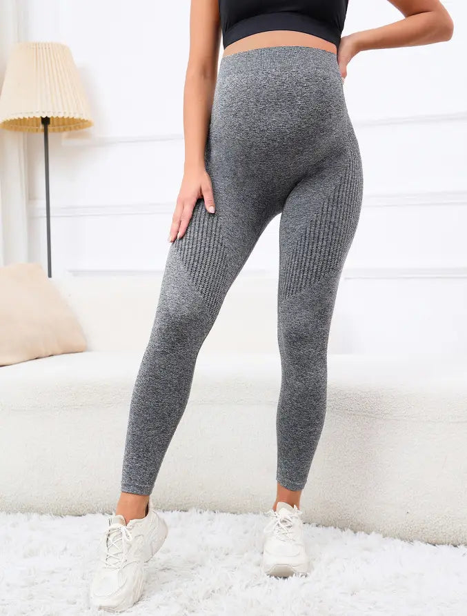 high-waisted gray ribbed maternity leggings made of textured stretchy fabric with belly support high waist for comfortable wear.