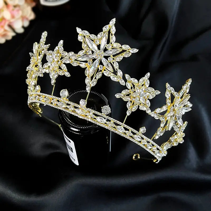 a sparkling gold tiara crown adorned with intricate crystal flowers and star-shaped embellishments from xingx rhinestone fashion accessories xingx rhinestone perfect for photography accessories xingx