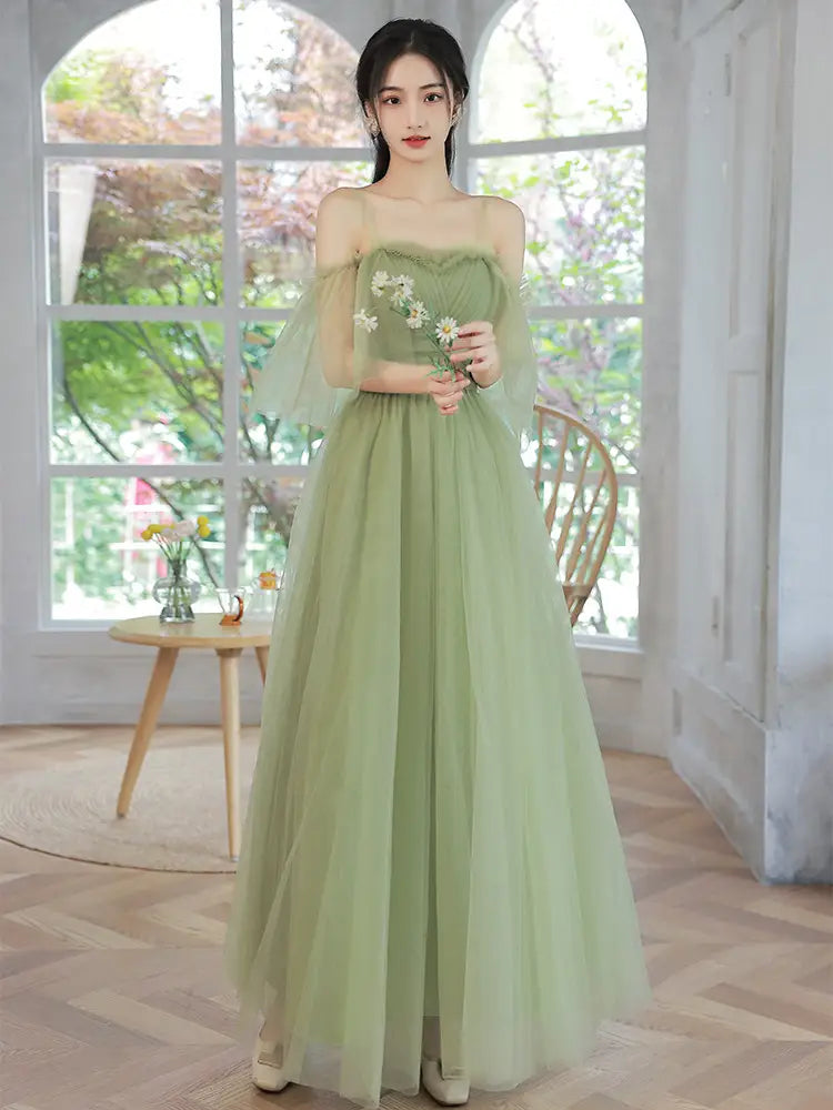 A flowing fruit green type fashion personalized long tulle dress with a sweetheart neckline and delicate floral embroidery.
