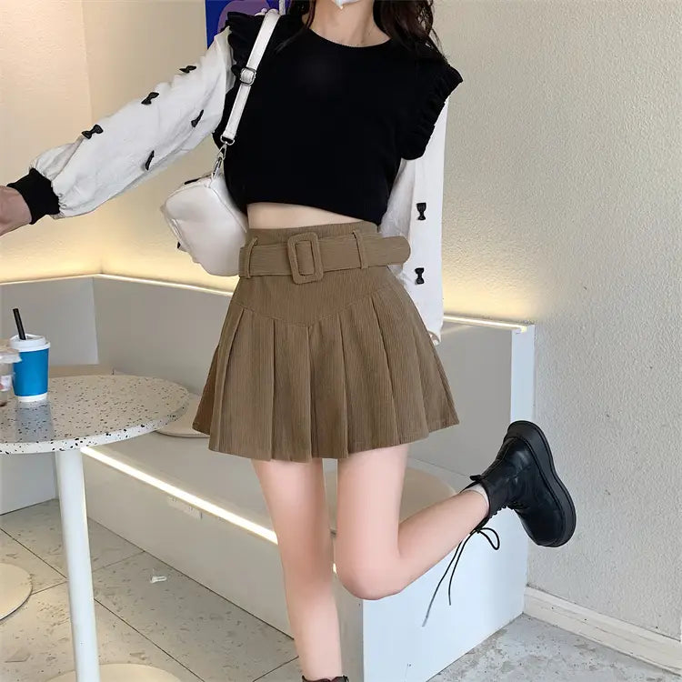 brown corduroy half skirt pleated mini with a matching belt featuring a rectangular buckle