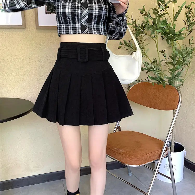 black corduroy half skirt pleated mini with a wide brown belt and rectangular buckle showcasing a skirt pleated skirt design.