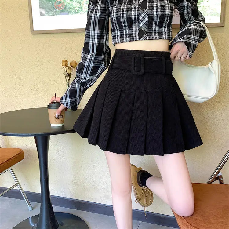 black corduroy half skirt pleated mini with a wide brown belted buckle for stylish wear