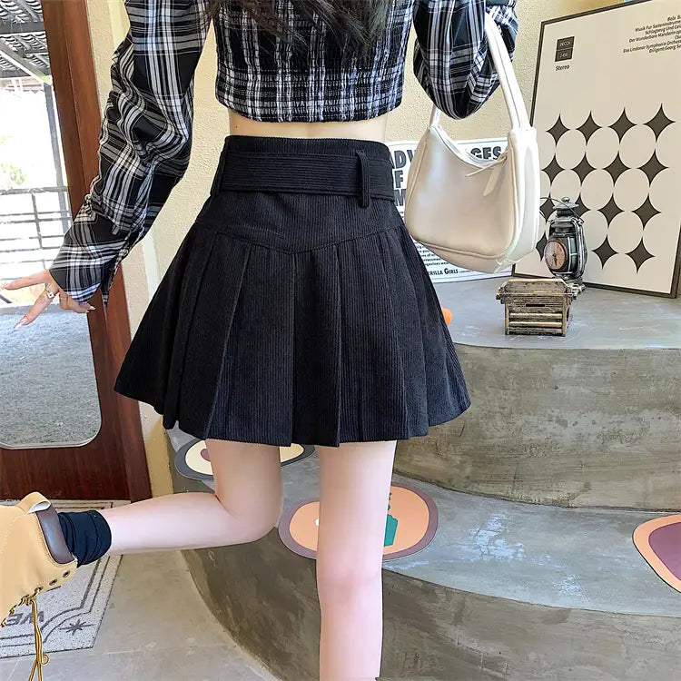 black pleated corduroy half skirt pleated mini with a matching brown belted corduroy half skirt pleated belt detail