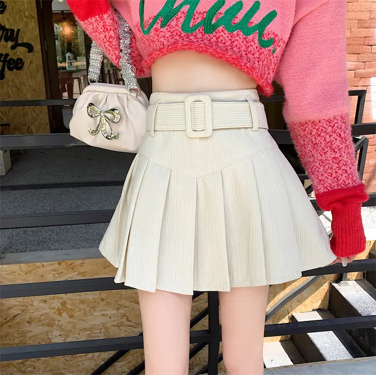 cream-colored corduroy half skirt pleated mini with matching brown belted buckle detail