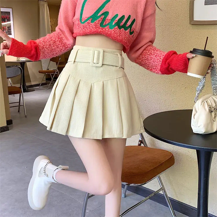 Beige corduroy half skirt pleated mini with a matching brown belt and pleated skirt design.
