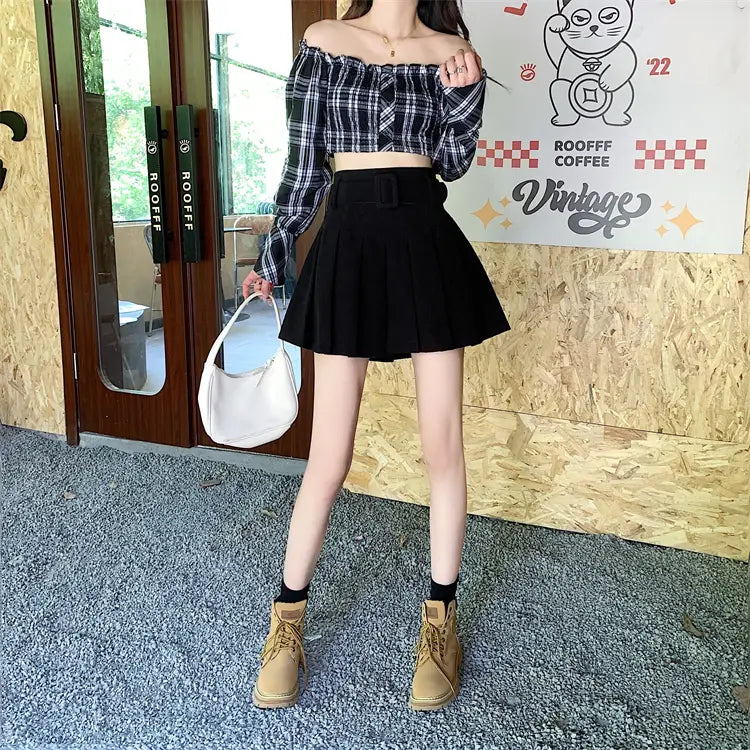 white curved shoulder bag paired with a brown belted corduroy half skirt pleated mini for a stylish skirt pleated skirt look