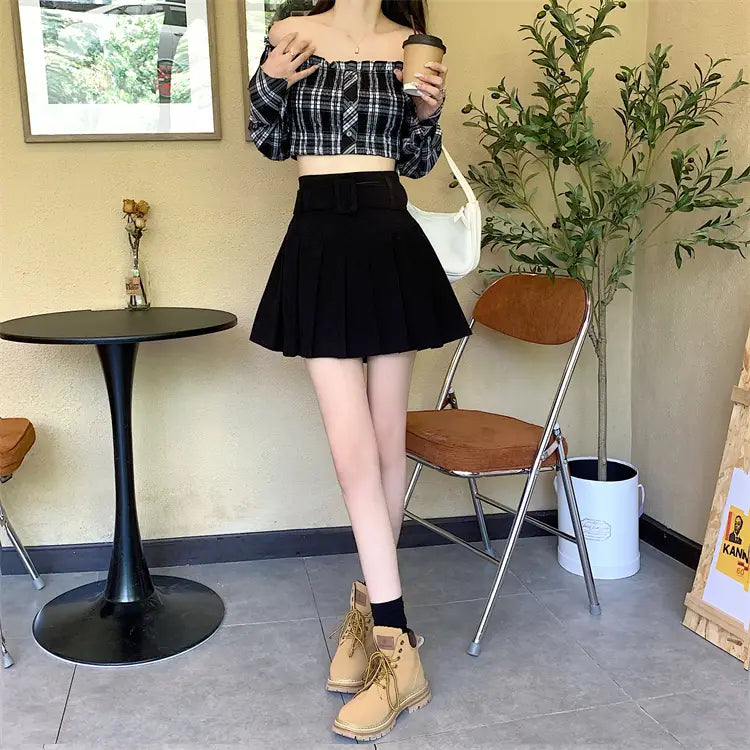 black pleated mini skirt with a high waist and large bow at the front paired with a brown belted corduroy half skirt pleated skirt.