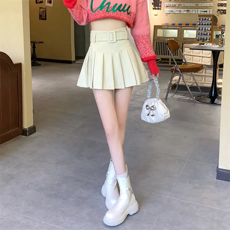 cream-colored corduroy half skirt pleated mini with a matching brown belted corduroy half skirt pleated style.