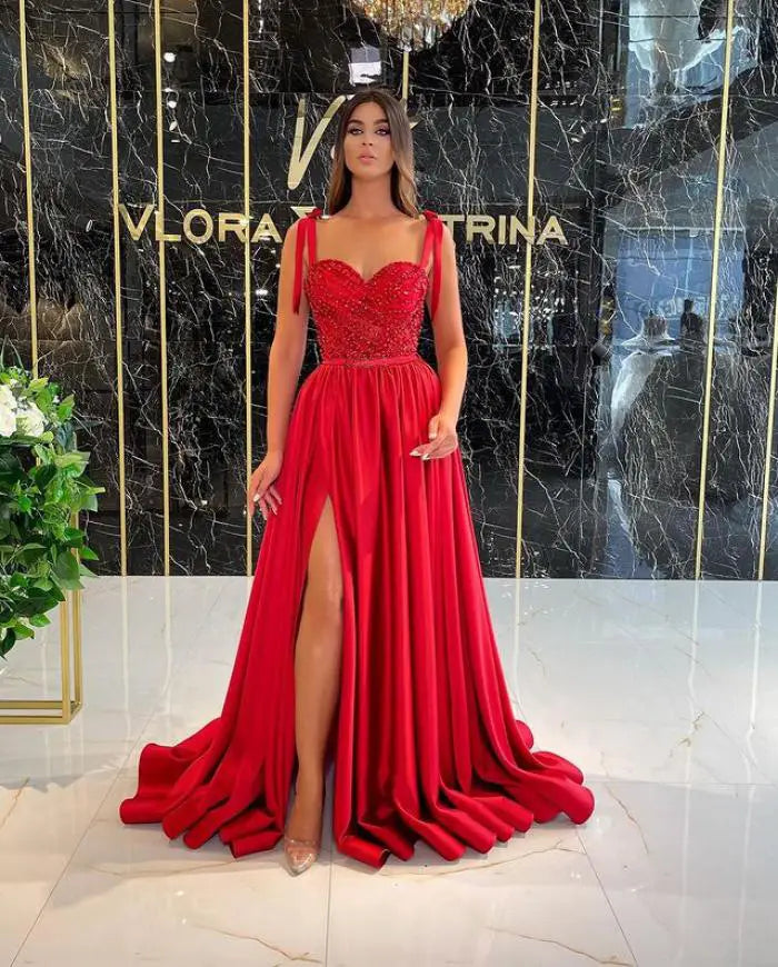A vibrant red polyester fiber evening dress featuring a beaded bodice and flowing chiffon skirt designed as a temperament long banquet gown.