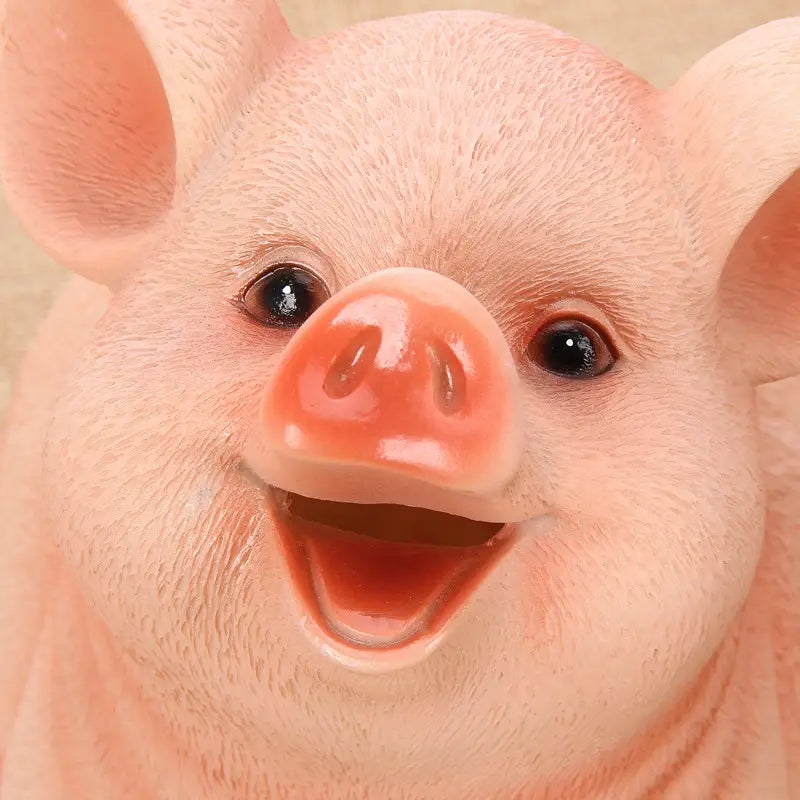 pink plastic pig piggy bank with glossy snout and textured skin used as a money box