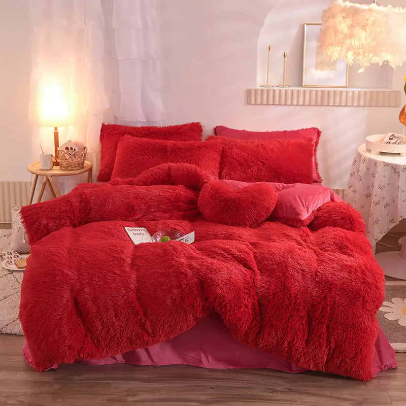 pink fluffy faux fur plush duvet cover set in red with matching pillows and a heart-shaped accent pillow for a cozy bed sheet or quilt cover arrangement