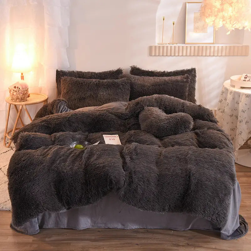 plush dark gray faux fur duvet cover set with matching pillows and a heart-shaped accent pillow featuring a soft and fluffy quilt cover design