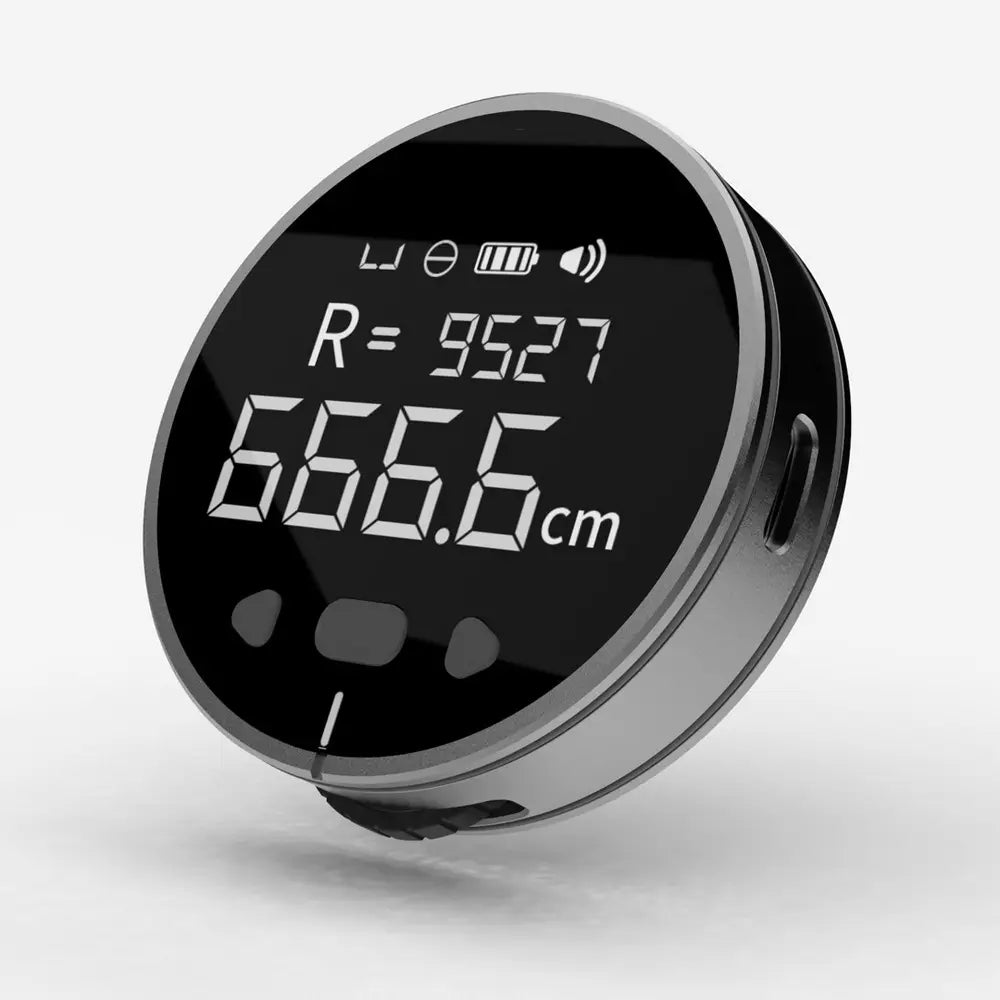 Black digital electronic measuring ruler with sleek metallic casing and circular LCD display showing measurements in centimeters