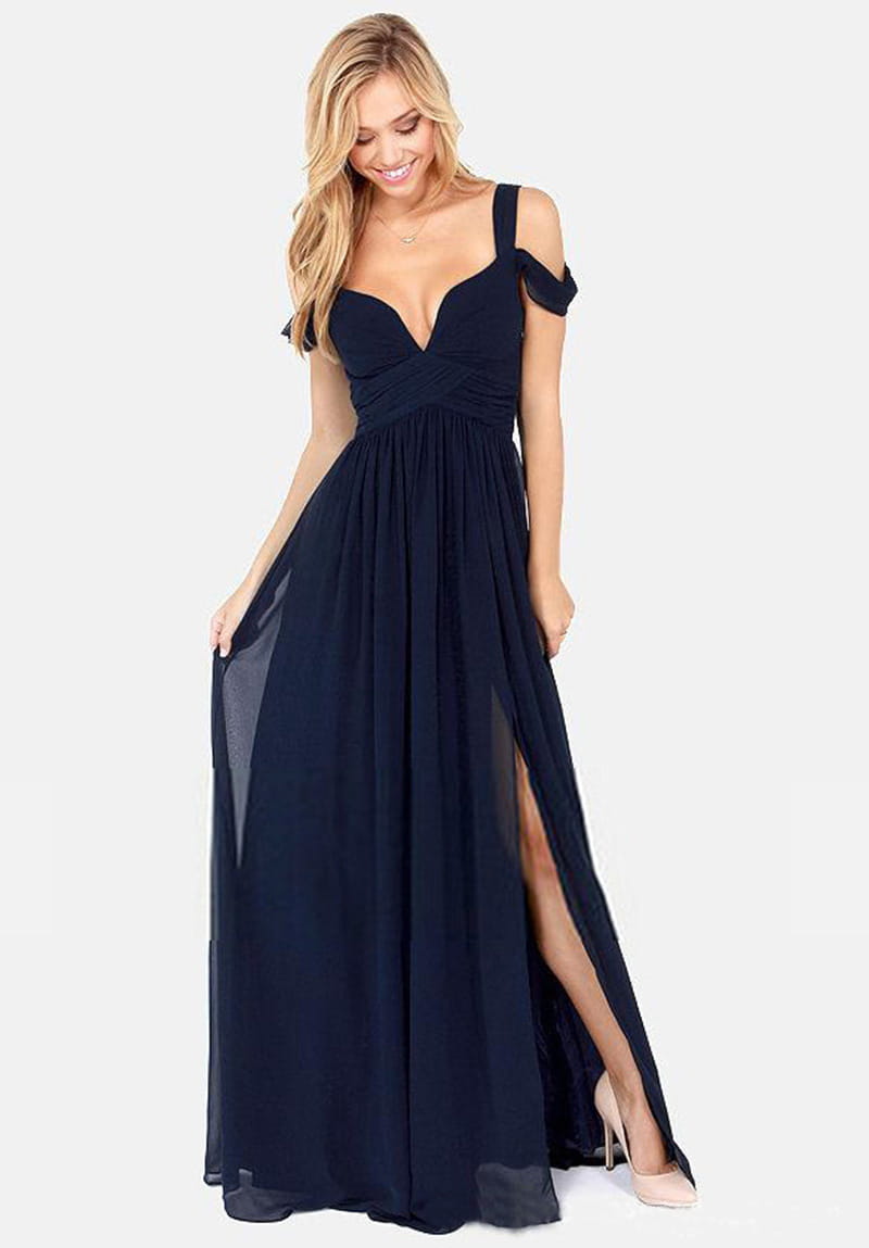 A floor length elegant navy blue chiffon maxi dress with a deep v-neckline, off-the-shoulder straps, and a high slit on the side in a length elegant greek style.