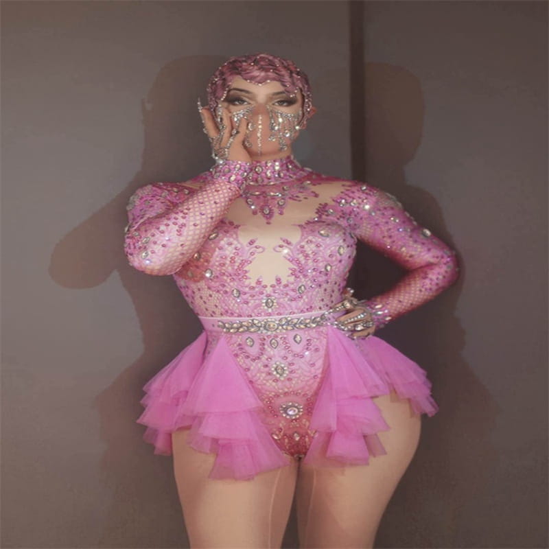 a sparkling pink sequined dance sexy shiny leotard with a ruffled tutu skirt and matching headpiece made of shiny rhinestone mesh for performance use