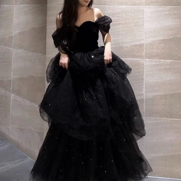 a black evening dress featuring a velvet bodice and layered tulle skirt with sparkling embellishments in a dress light luxury style for evening occasions