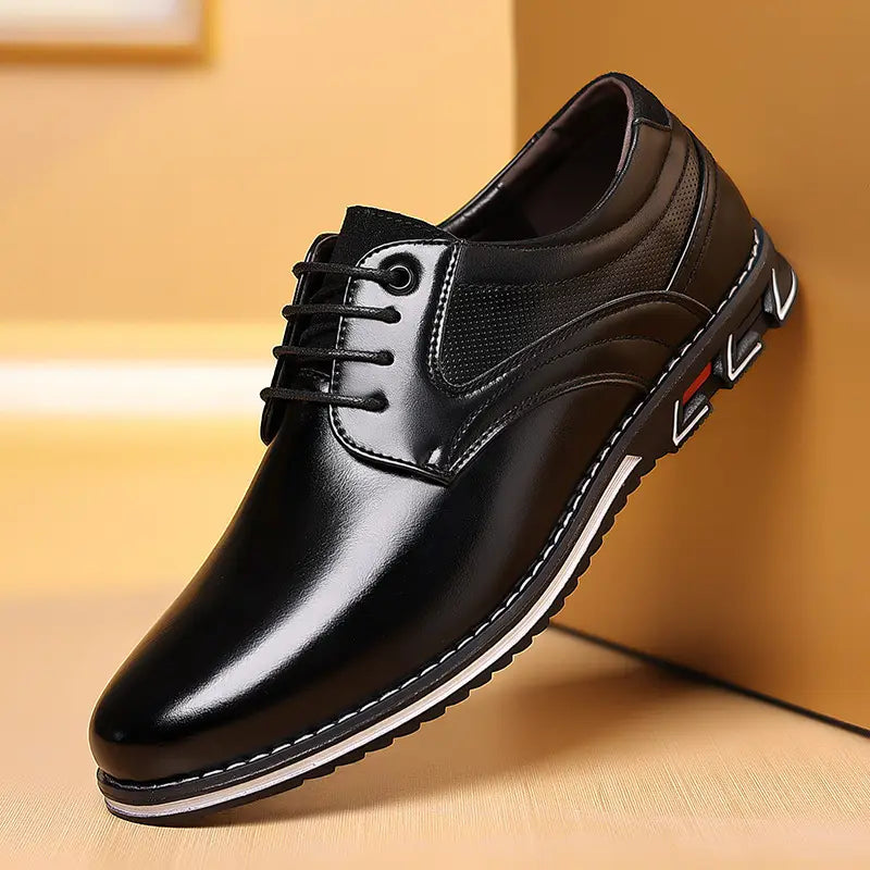Black leather lace-up men’s dress shoe with glossy finish and white stitching along the sole featured in brown textured work fashion leather shoes collection.