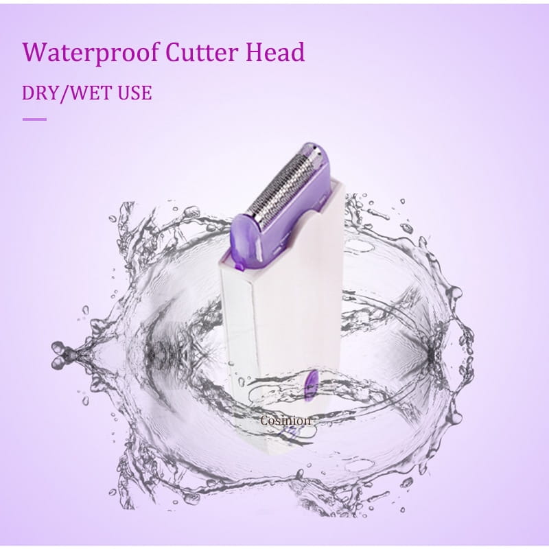 Purple waterproof cutter head of the induction type lady hair removal device with a sleek metallic blade assembly and ergonomic plastic housing designed for dry or wet use.