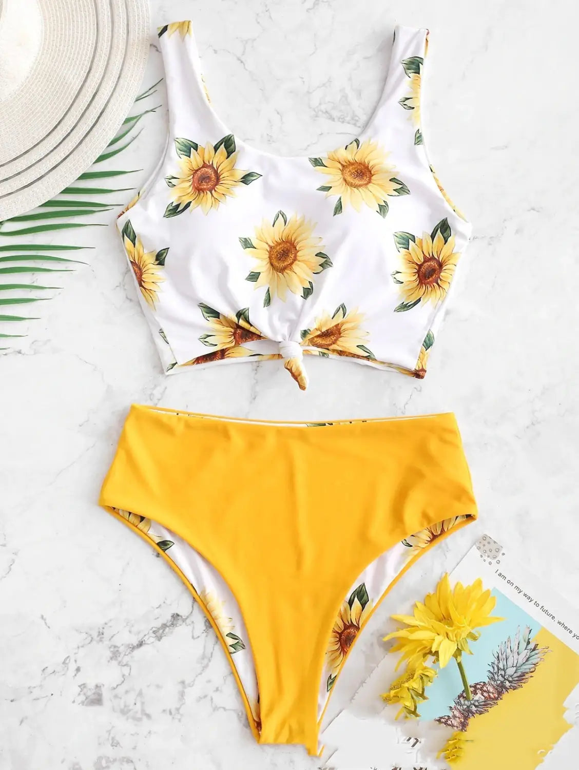 white and yellow sunflower-printed crop top with tied front detail featured in a white knot front printed sunflower bikini perfect for a printed sunflower bikini look.