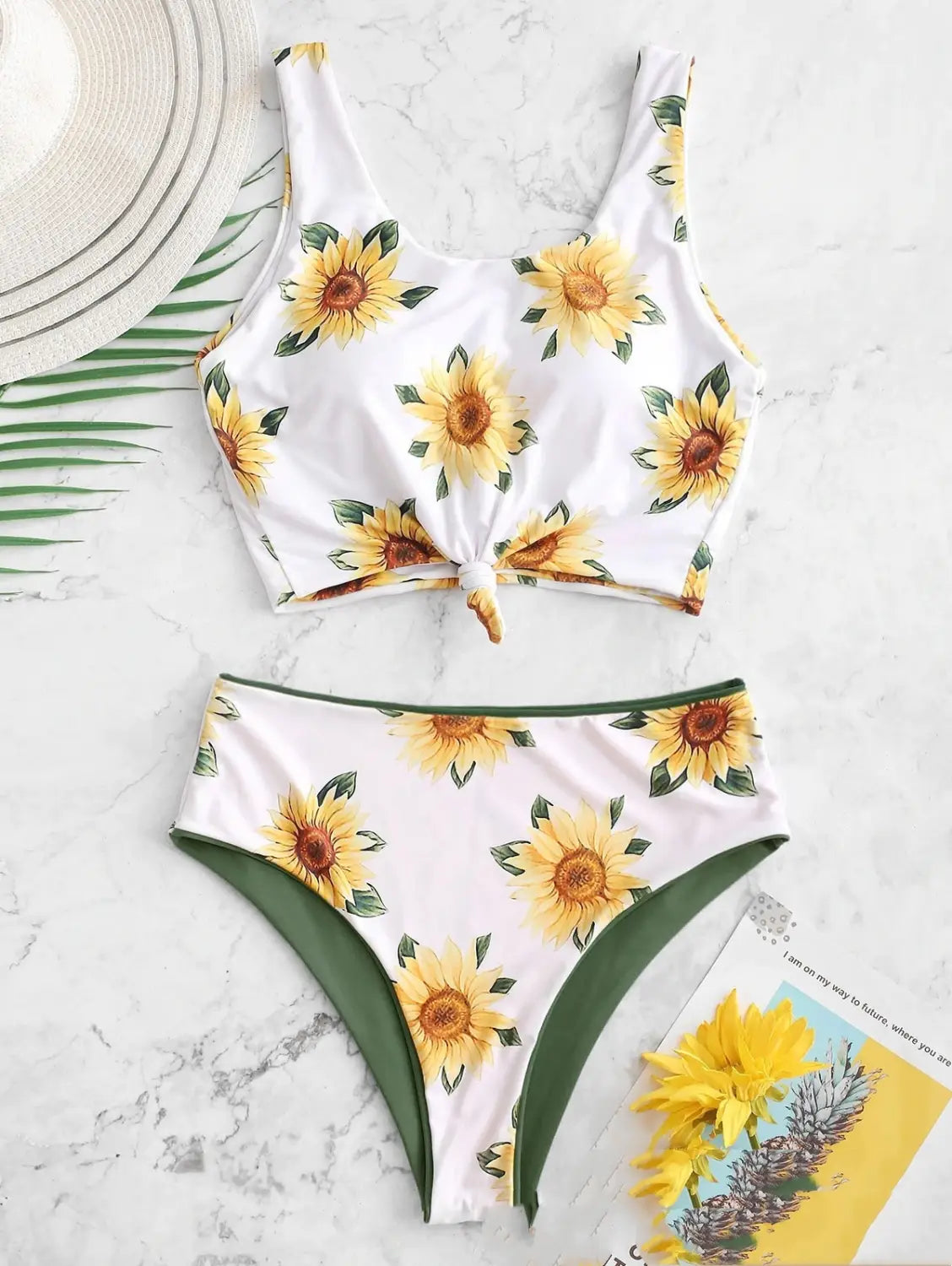 white knot front printed sunflower bikini featuring a white two-piece swimsuit with green trim and a tied front detail in a printed sunflower bikini design