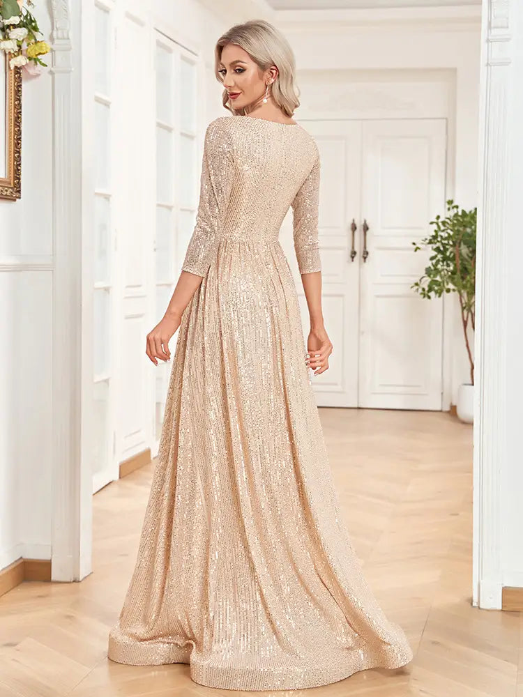 A shimmering champagne-colored sequined party formal dress with a fitted bodice and high waist flowing skirt.