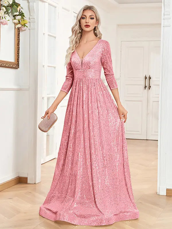 A shimmering pink sequined high waist party formal dress with a v-neckline and three-quarter sleeves.