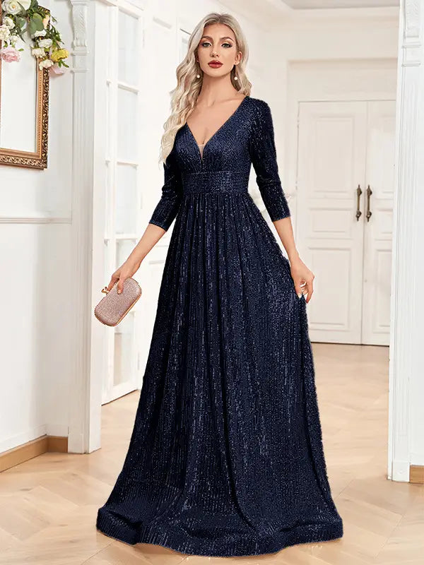 A navy blue sequined evening gown with a deep v-neckline and three-quarter sleeves designed as a high waist party formal dress.