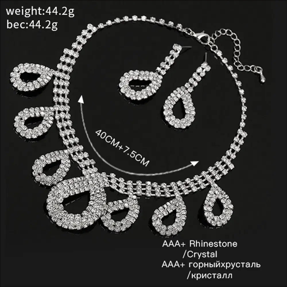 silver rhinestone necklace set with dangling teardrop-shaped charms and matching earrings featuring aaa+ quality crystals designed as korean wedding wedding dress accessories