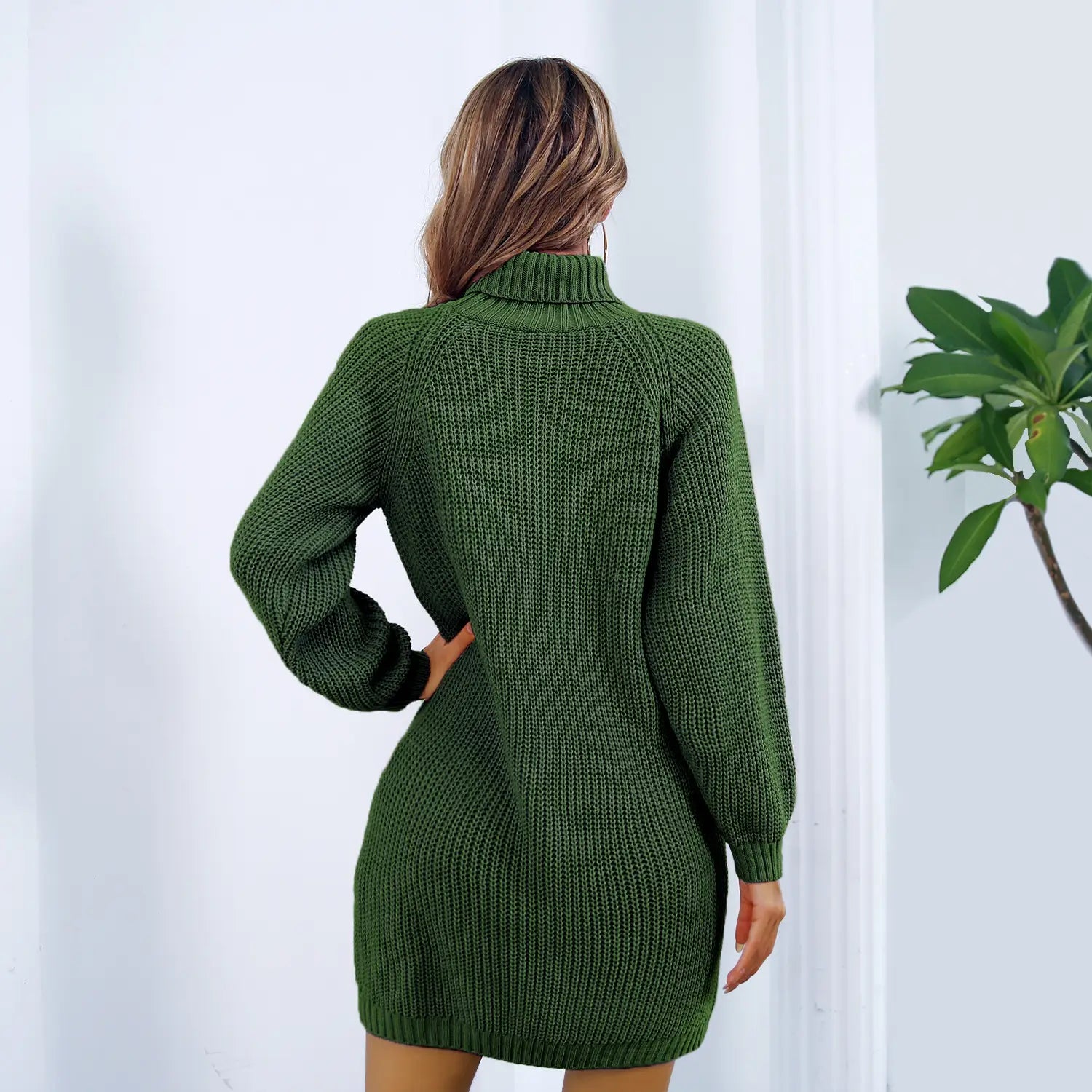 Olive green ribbed knit long sleeve sweater dress with a winter turtleneck designed for cold weather.