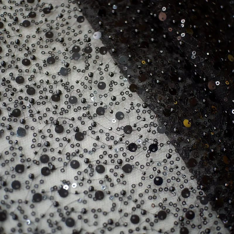 black and silver sequined pearl embroidery lace asymmetric dress fabric with sheer glittery mesh texture