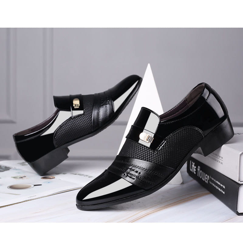 Black and white mesh patent leather shoes featuring a textured mesh panel and gold-tone buckle accents in leather shoes design.
