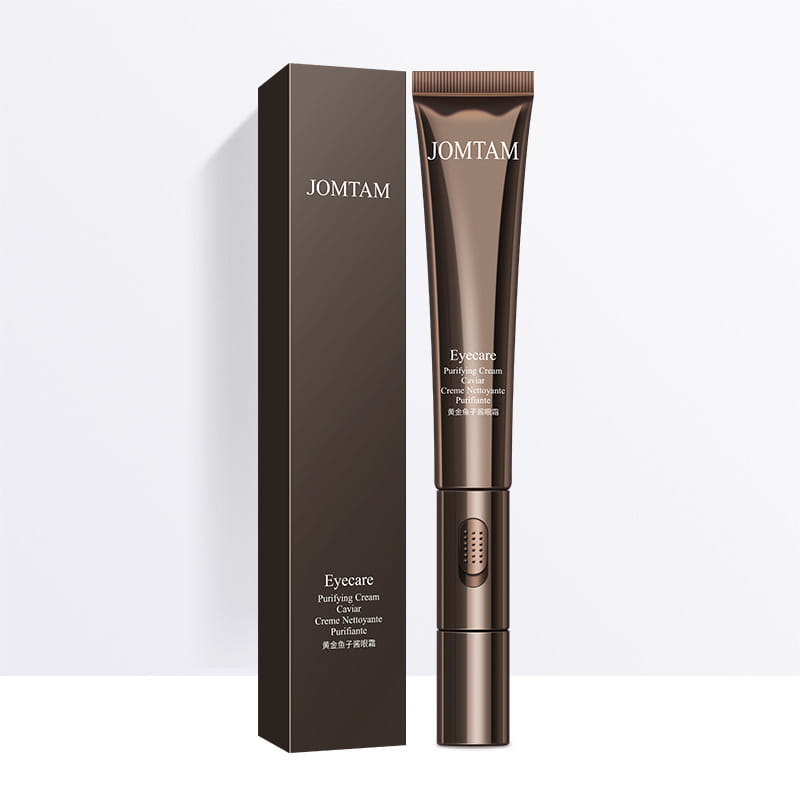 Jomtam brand brown metallic tube of eye care purifying cream with caviar designed to improve eye bags and provide eye bags firming benefits with a facial device.