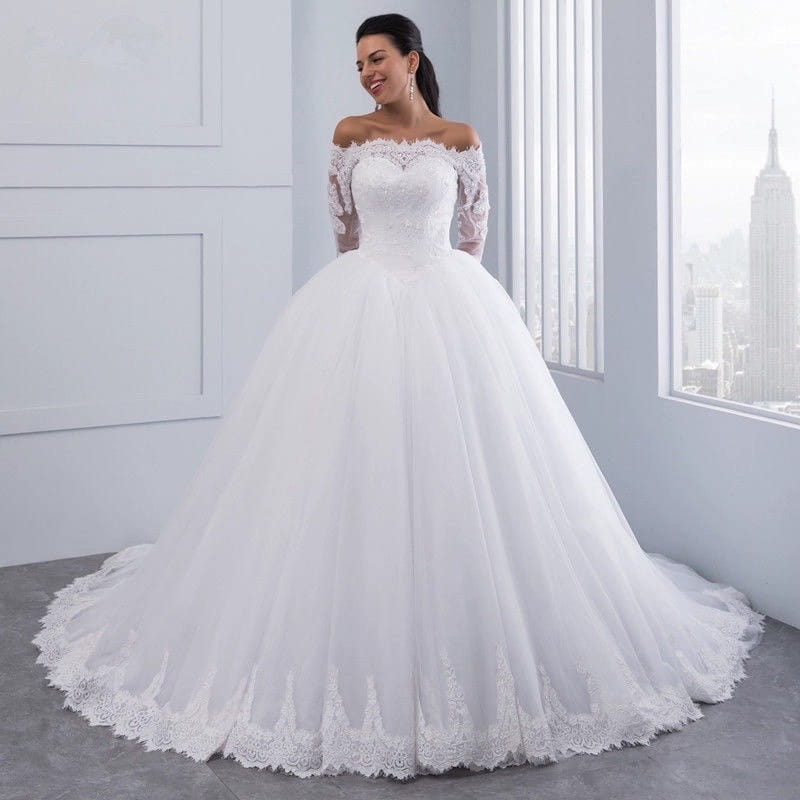 a white off-the-shoulder bridal wedding lace gown featuring long lace sleeves and a voluminous wedding lace large tulle skirt