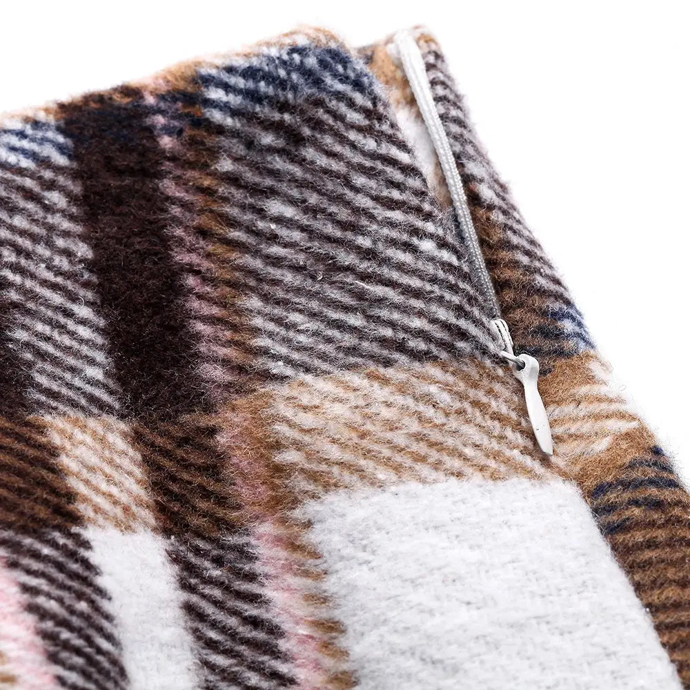 a cozy textured plaid scarf in earthy brown beige and soft pink tones with a silver zipper pull paired with a high waist plaid tight pencil wool mini skirt
