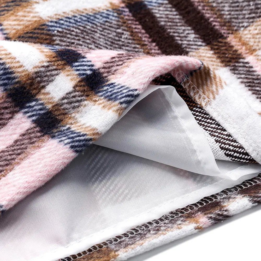 a cozy soft plaid blanket featuring pink brown navy blue and white stripes displayed alongside a high waist plaid tight pencil wool mini skirt