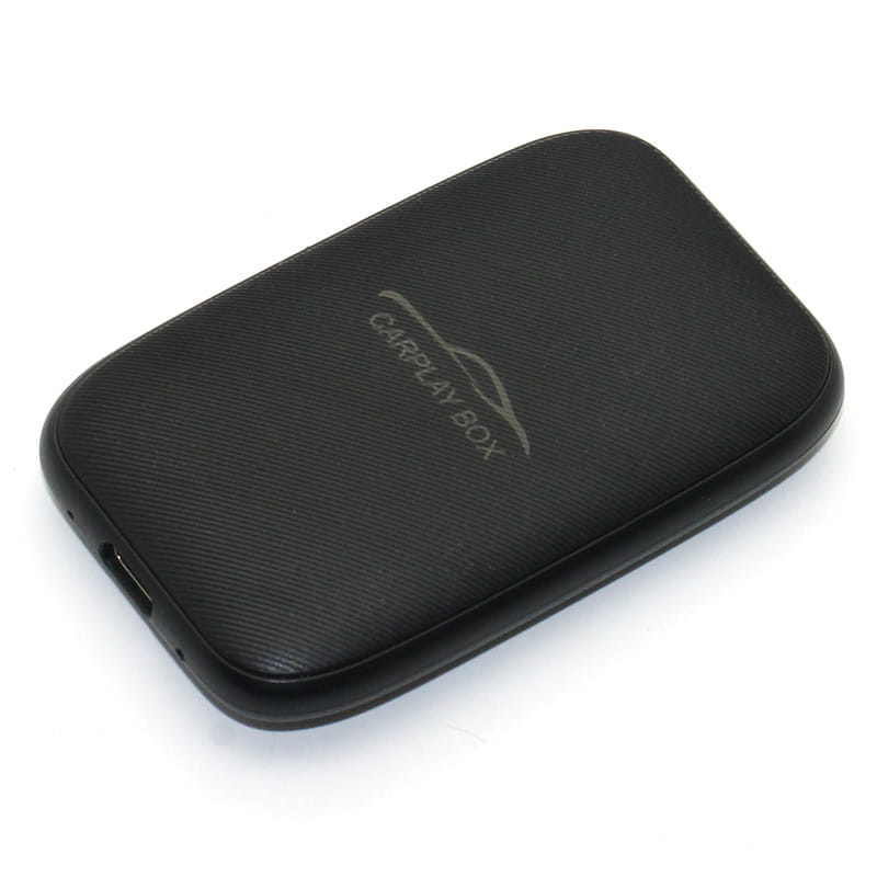 Black textured wireless carplay and android auto closed system box device with a subtle silver logo for original car integration.