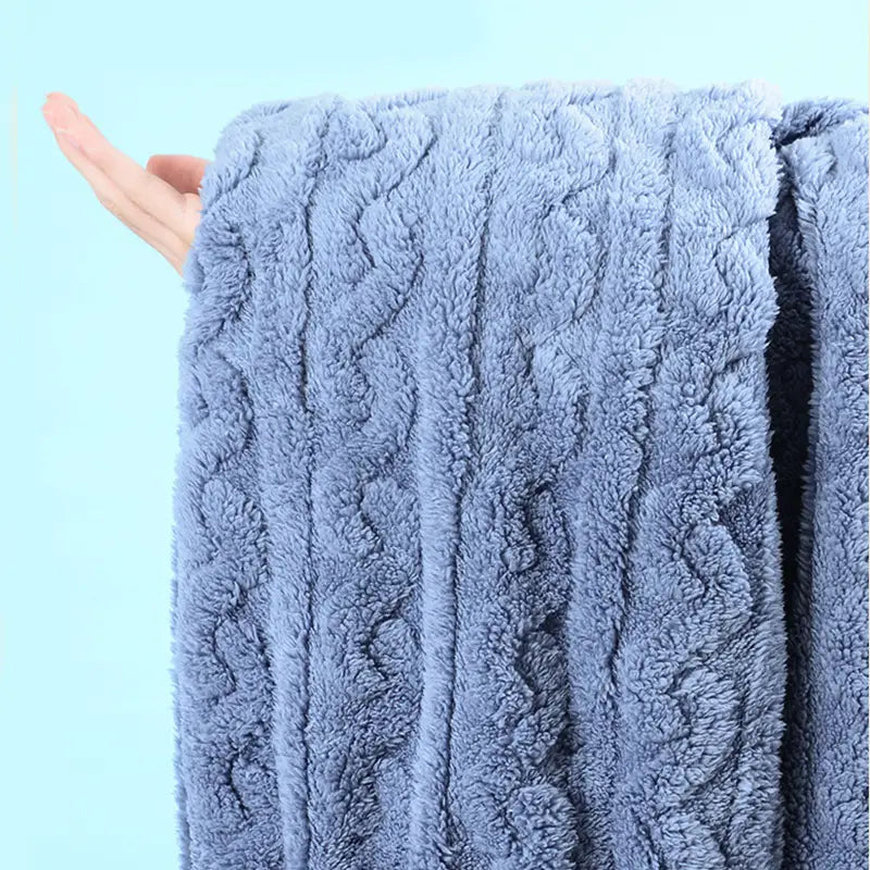 a soft light blue plush blanket with a textured hemp pattern cable knit featured alongside thickened coral velvet winter pajamas sets