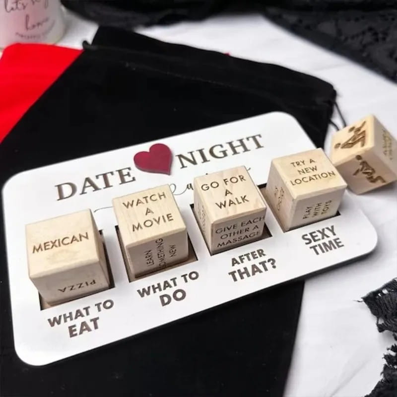 white wooden date night dice game board featuring engraved activity dice cubes with options like mexican pizza and watch a movie for creative date night ideas.