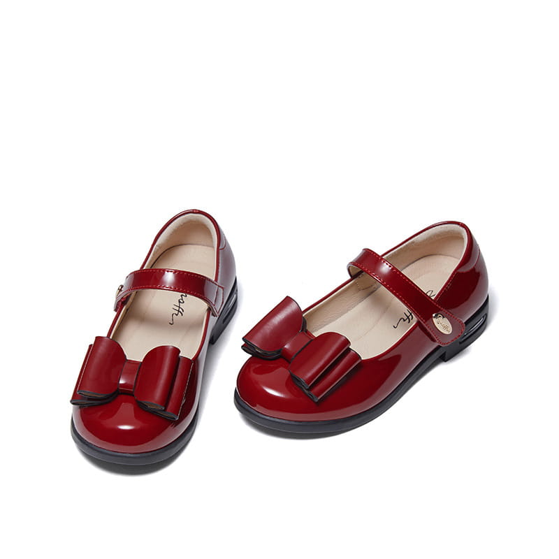 Shiny red patent leather girl shoes princess featuring a prominent bow on the front designed for stylish princess shoes.