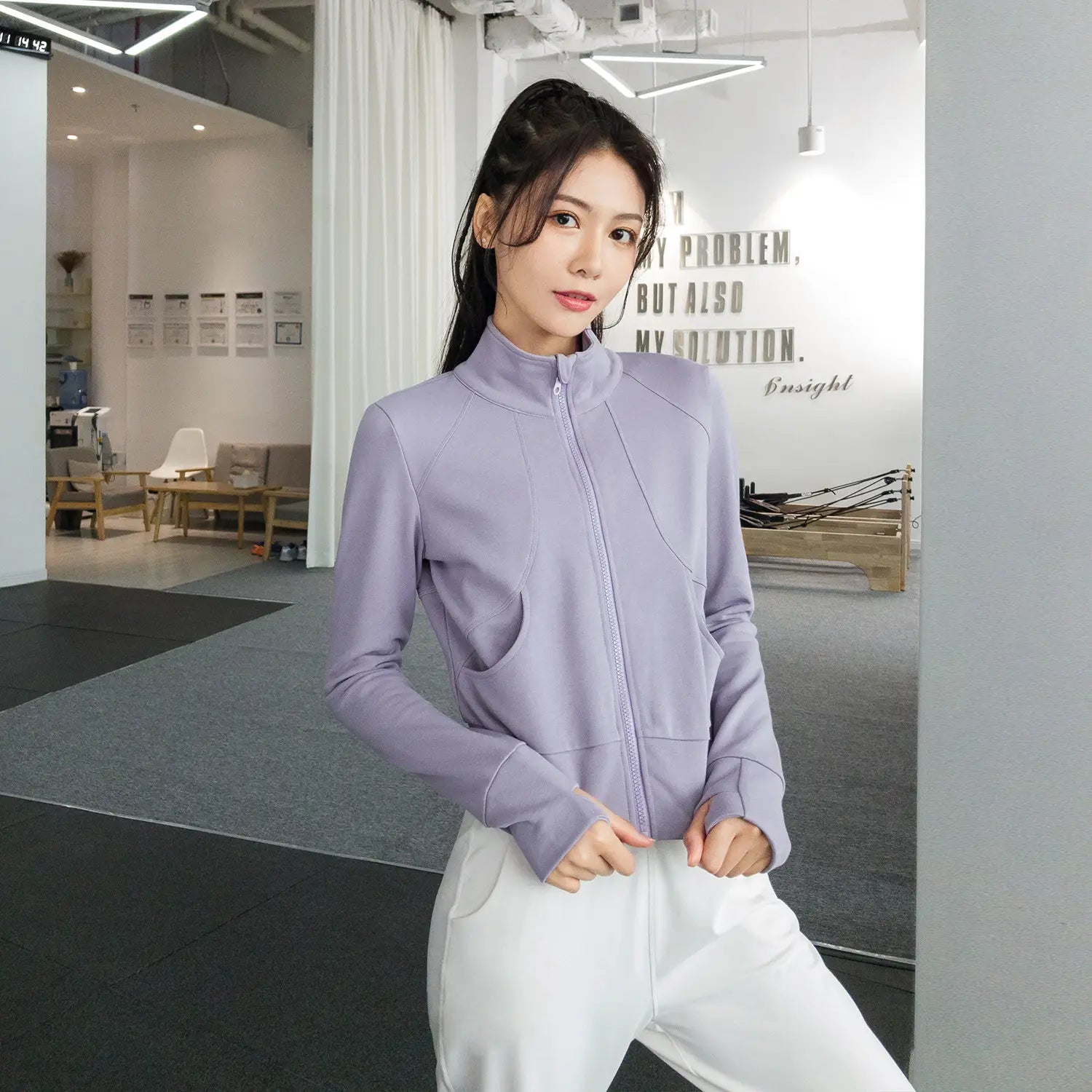 Lavender zip-up athletic jacket with long sleeves and front pockets designed for winter running sport, part of the royale essence lux running sport coat collection.