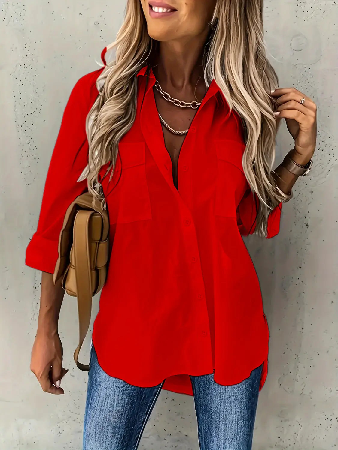 Red loose long sleeve lapel button down shirt featuring a vibrant red color, v-neck, and three-quarter sleeves in a loose long sleeve fit.