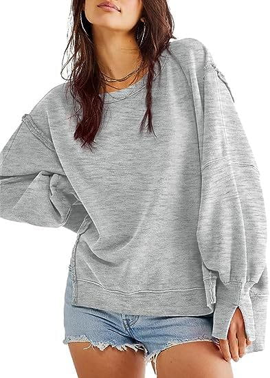 A soft heather gray solid oversized sweatshirt crew neck with long sleeves and a relaxed fit featuring side zippers.