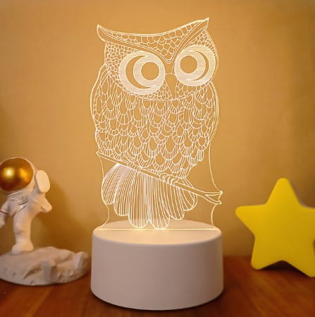 White owl-shaped 3d led night light with intricate line detailing on a circular base featuring colorful touch remote control lights for adjustable ambiance.
